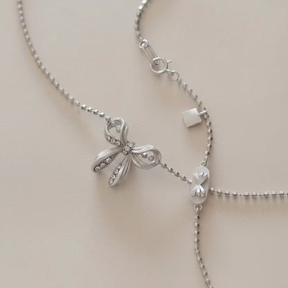 Silver Cylinder-shaped Beaded Chain with Butterfly Bowkont Charm Pendant